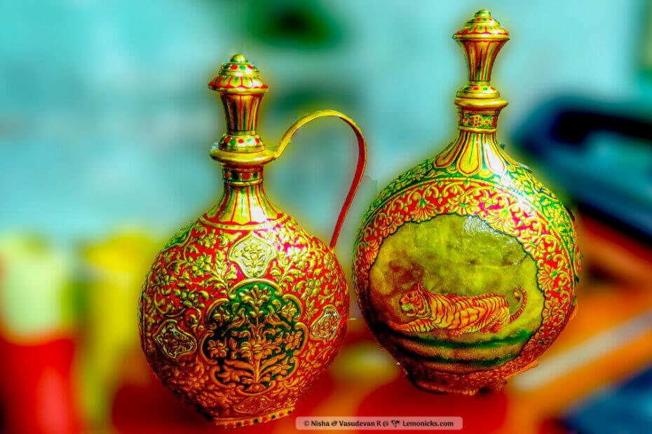Golden ceramic pottery from Bikaner featuring traditional motifs and rich ornamentation.