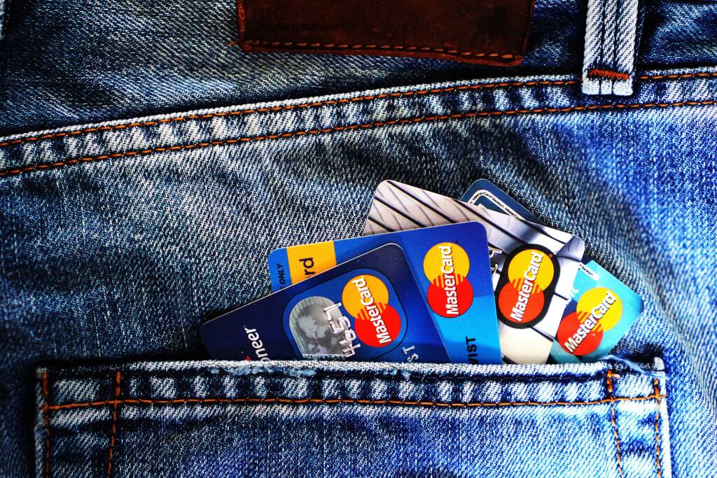 Multiple bank debit & Credit cards fanned out, depicting financial independence and decision-making.